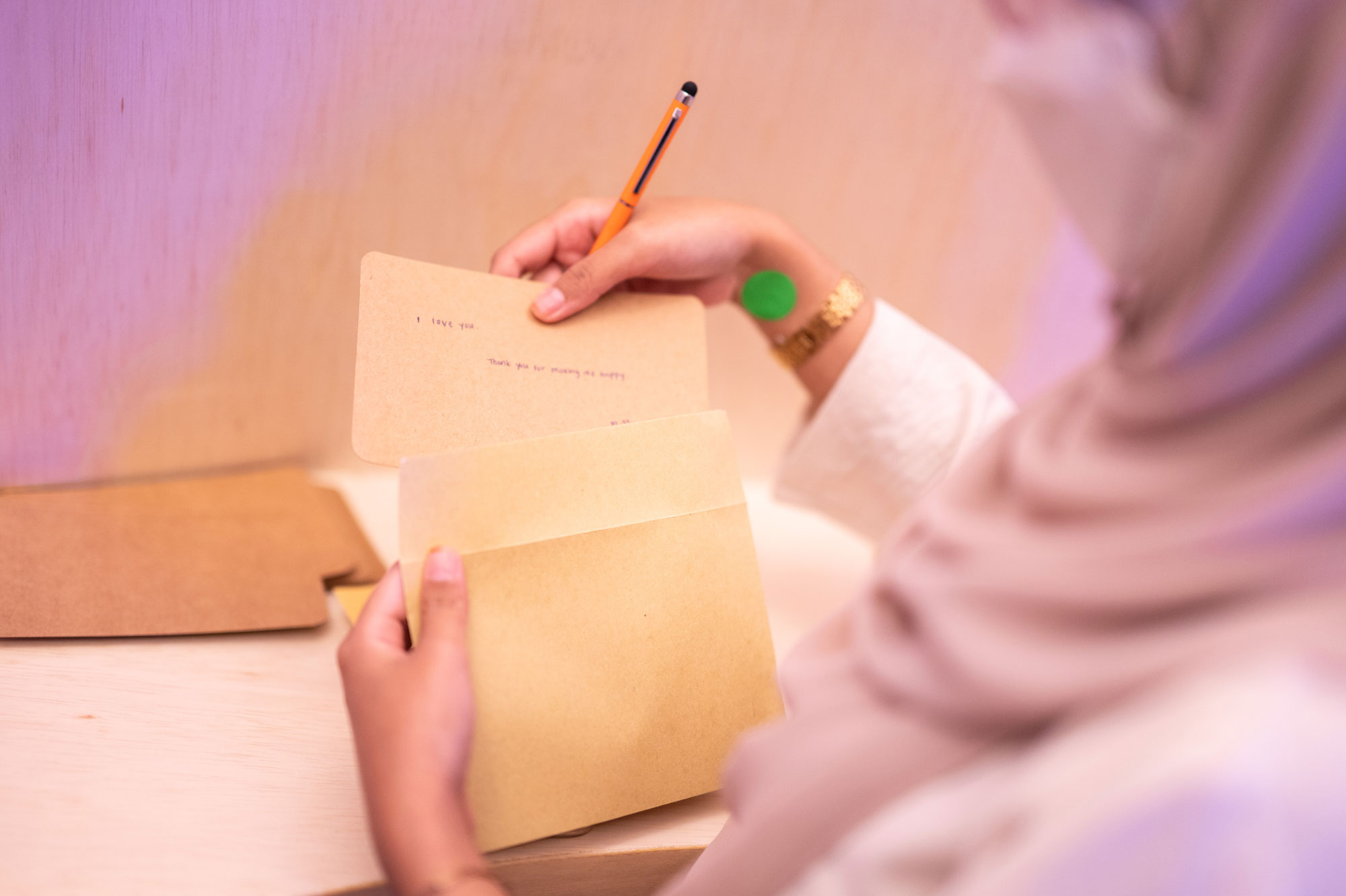 A visitor penning down a note to someone